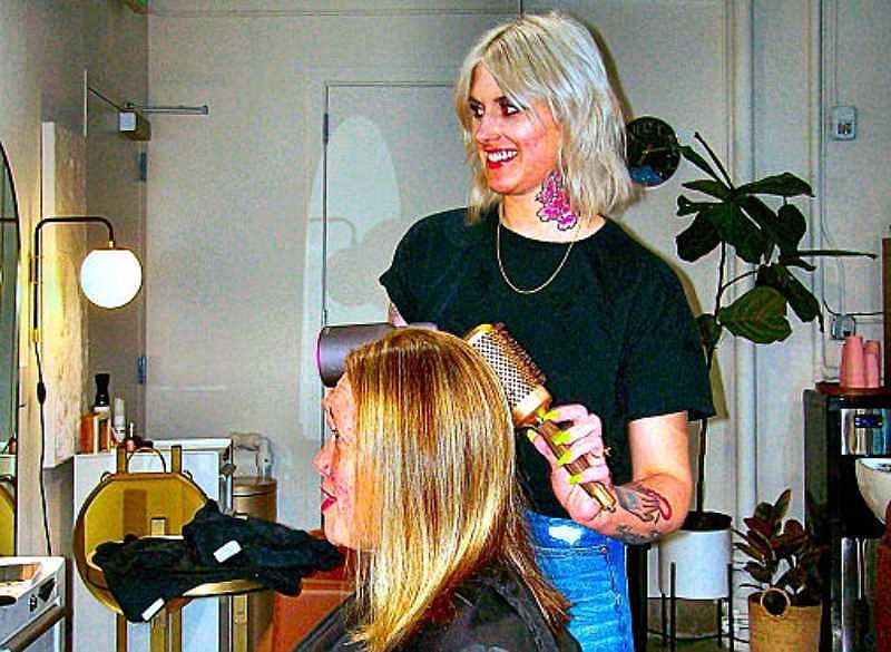 At The Lightening Society hair salon in Brooklyn, stylist Tiffany Crist works on client Molly.